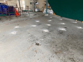 Commercial floor had sunken due to poor compaction. Raised the sinking area to its corrected height and slope.