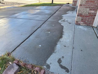 Sunken driveway. Raised the concrete to its corrected height, level along joint.
