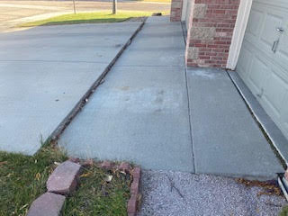 Sunken driveway in Broomfield, CO. Raised the concrete to its corrected height, level along joint.