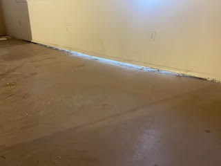 Indoor slab was raised approximately 2 inches to its corrected height, closing the concrete gap