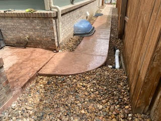 Raised the concrete sidewalk in Longmont, CO to corrected height and slope, eliminating tripping hazards.