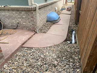 Raised the concrete sidewalk to corrected height and slope, eliminating tripping hazards.